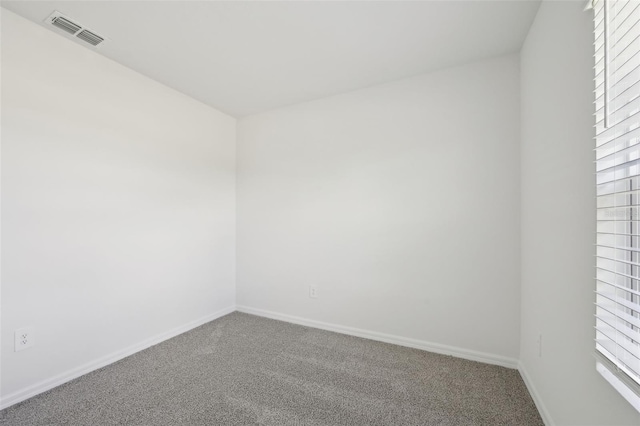 unfurnished room featuring carpet flooring