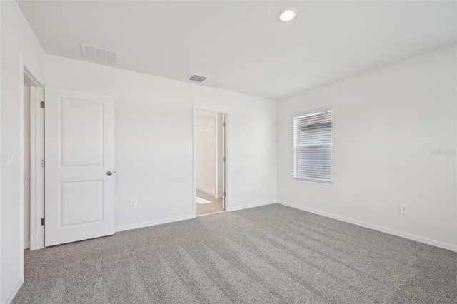 unfurnished room featuring carpet flooring