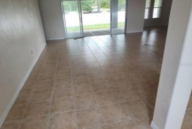 view of tiled spare room