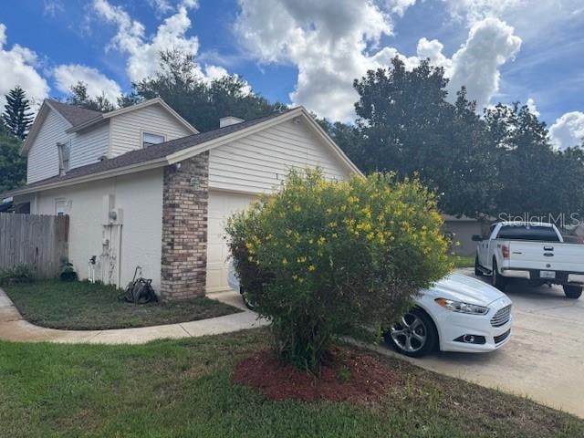 view of property exterior featuring a garage