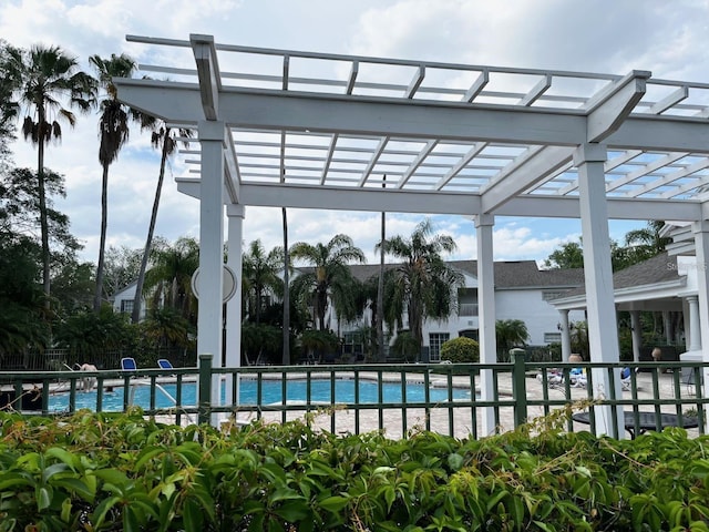 view of swimming pool with a pergola