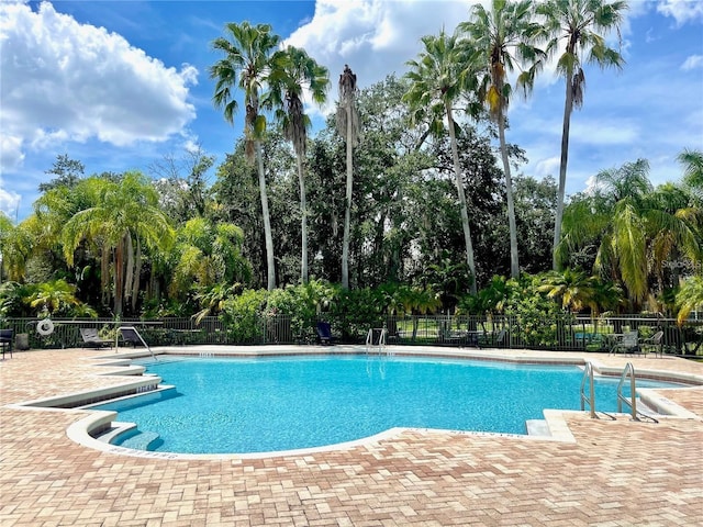 view of swimming pool featuring a patio area