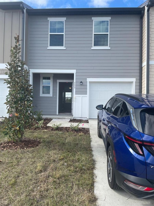 view of front of home with a garage