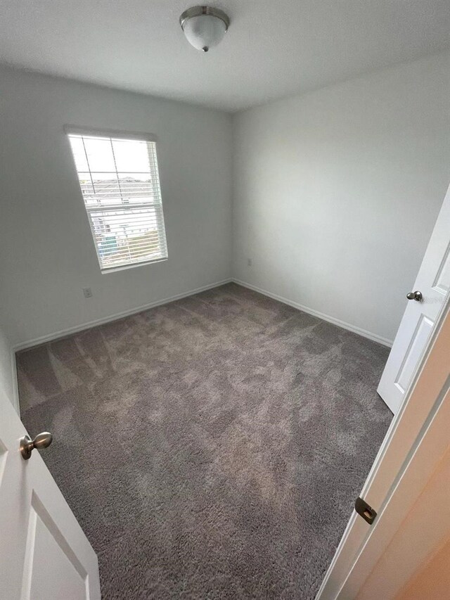 153 Mandovi St, Davenport, FL 33837 - unfurnished room featuring carpet floors