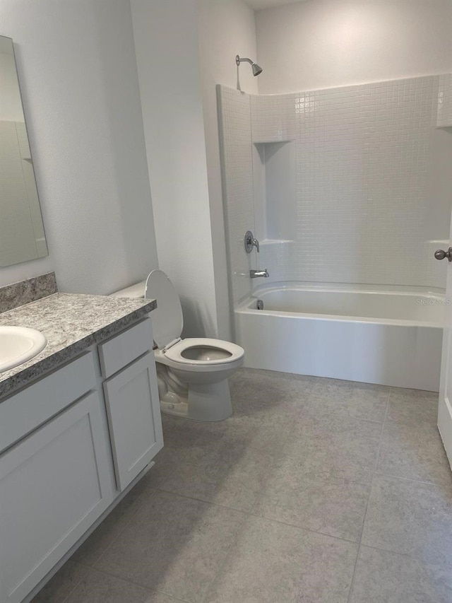 full bathroom featuring tile patterned floors, vanity, shower / tub combination, and toilet