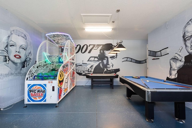 playroom featuring a textured ceiling and billiards