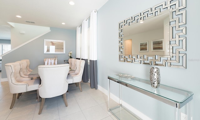 dining area featuring light tile patterned floors