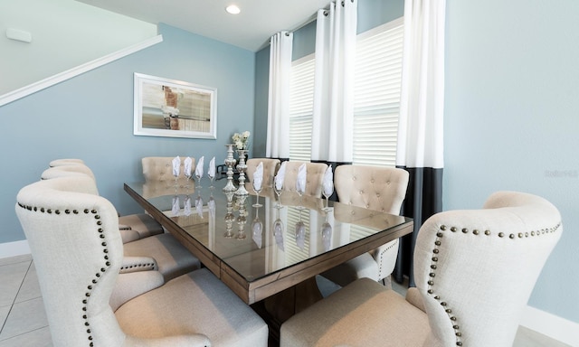 dining space featuring light tile patterned floors