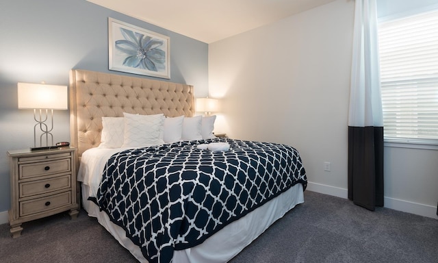 carpeted bedroom with multiple windows