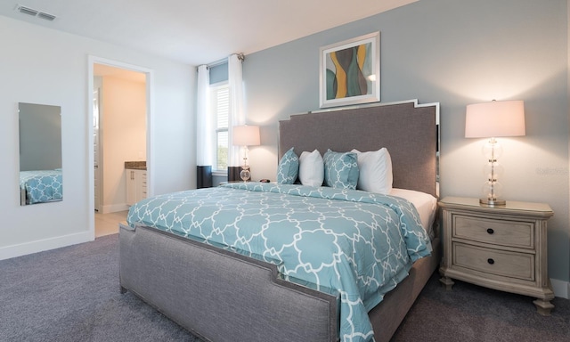 bedroom featuring carpet and ensuite bathroom