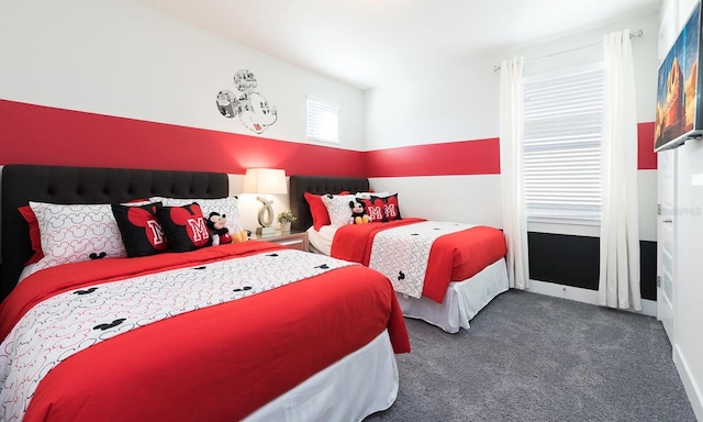 bedroom featuring dark colored carpet