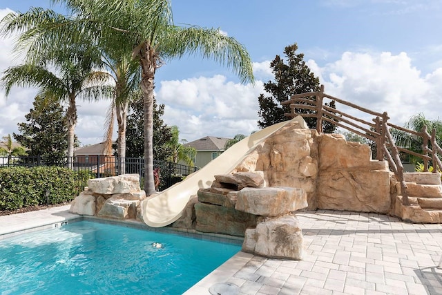 view of pool featuring a water slide