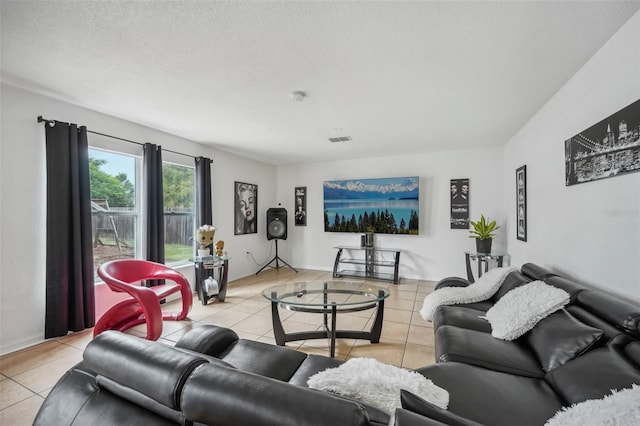 tiled living room with a textured ceiling