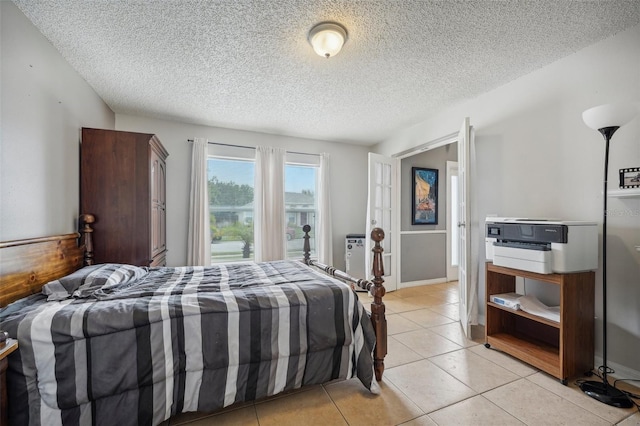 tiled bedroom with a textured ceiling