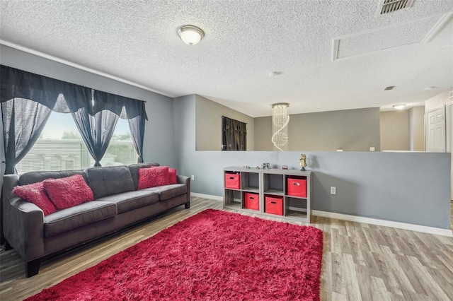 living room featuring hardwood / wood-style floors and a textured ceiling