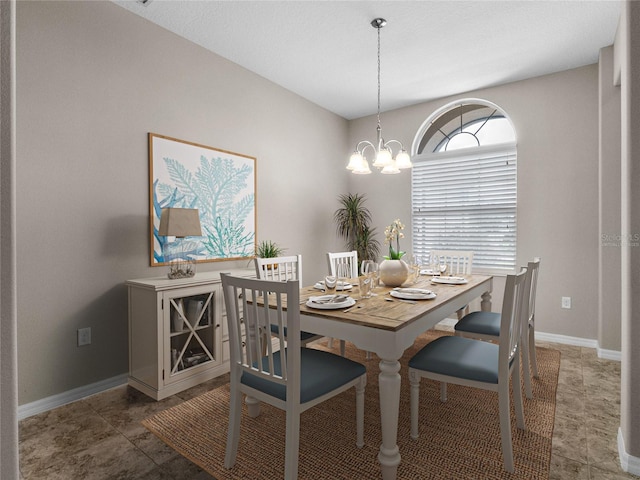 dining room with a chandelier