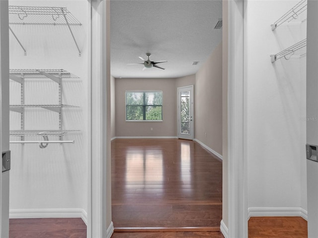 interior space with hardwood / wood-style flooring and ceiling fan