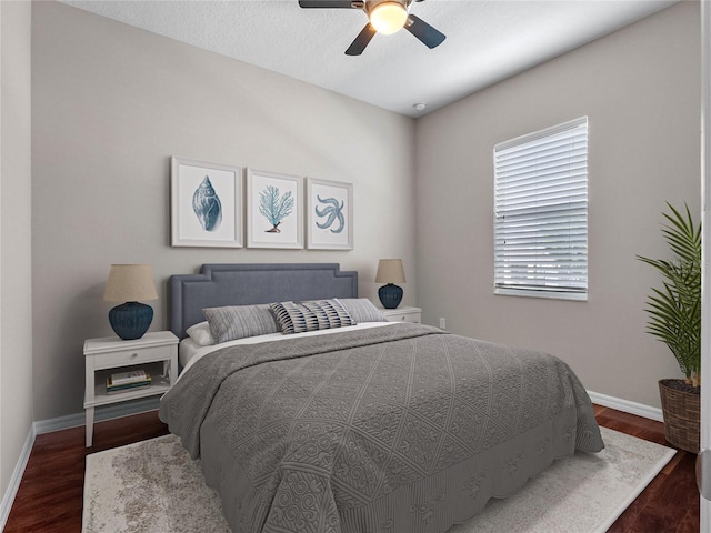 bedroom featuring dark wood-type flooring and ceiling fan