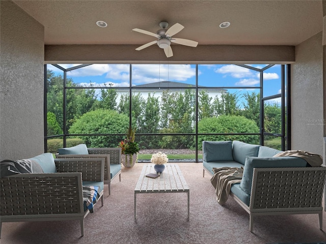 sunroom featuring ceiling fan