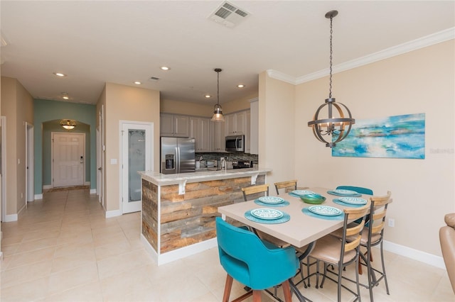 dining area with light tile patterned floors, recessed lighting, visible vents, a chandelier, and baseboards