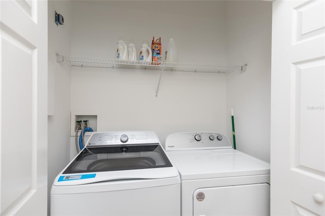 laundry area with laundry area and separate washer and dryer