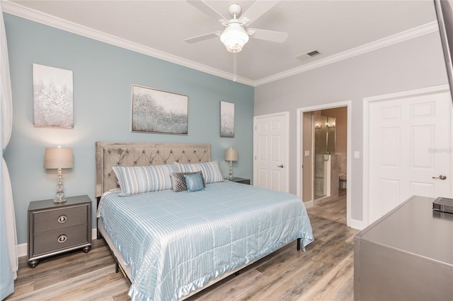 bedroom featuring visible vents, wood finished floors, and ornamental molding