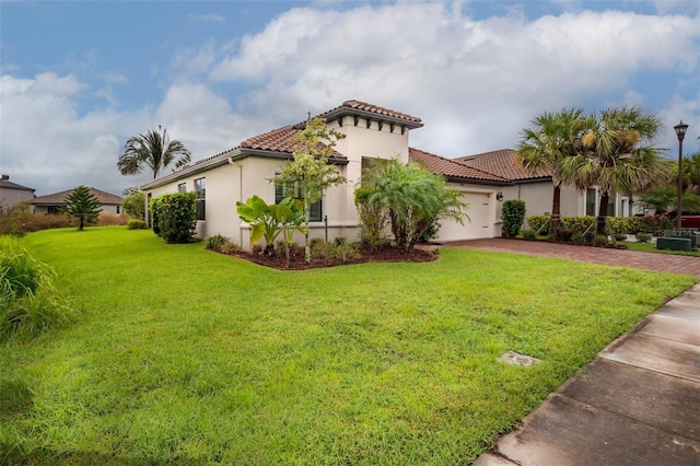 3951 Carrick Bend Dr, Kissimmee, FL 34746 - view of home's exterior featuring stucco siding, a yard, a tiled roof, driveway, and an attached garage
