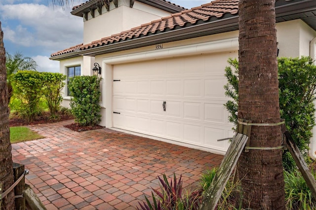 3951 Carrick Bend Dr, Kissimmee, FL 34746 - garage with decorative driveway