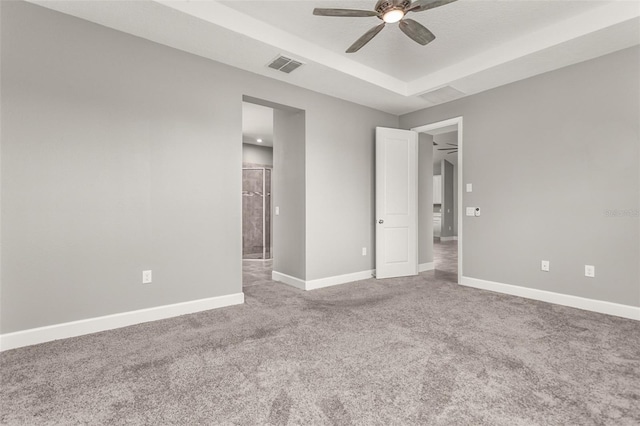 3951 Carrick Bend Dr, Kissimmee, FL 34746 - unfurnished bedroom featuring ensuite bath, carpet, baseboards, visible vents, and a raised ceiling