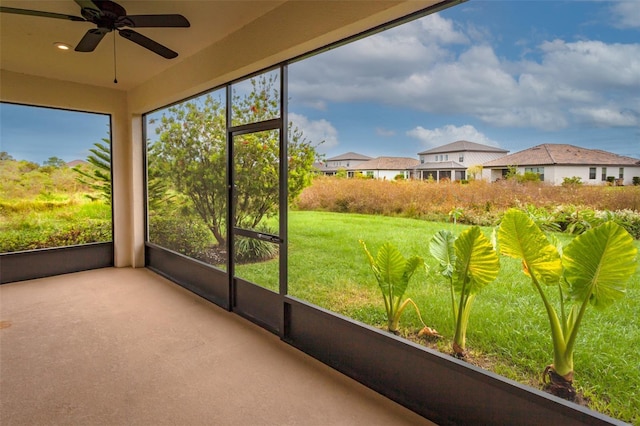 3951 Carrick Bend Dr, Kissimmee, FL 34746 - unfurnished sunroom with a ceiling fan and a residential view