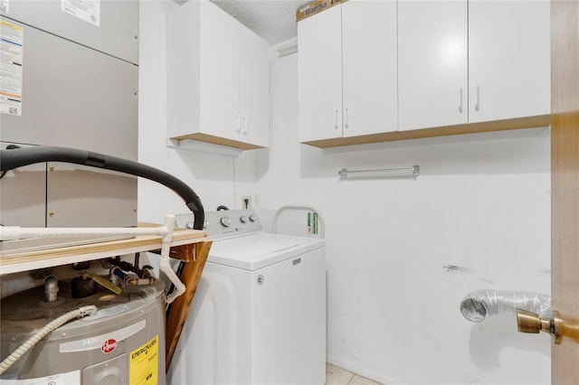 laundry area with washer / dryer, a textured ceiling, cabinets, light tile patterned floors, and electric water heater