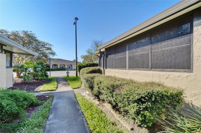 view of yard featuring a sunroom