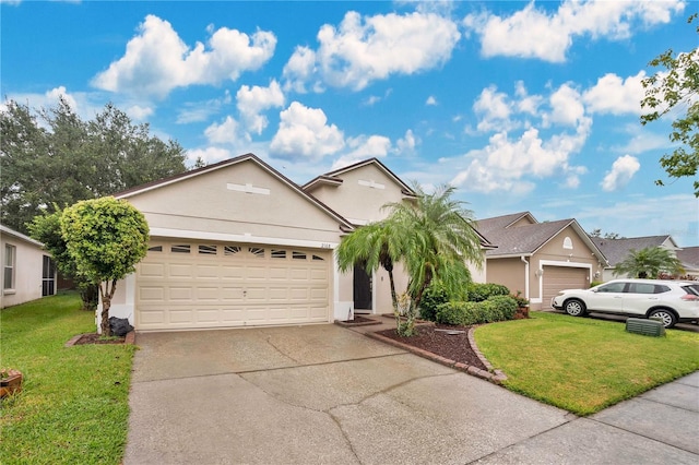 view of front facade with a front yard and a garage