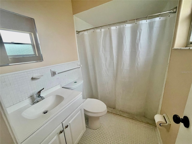 bathroom with tile walls, vanity, tile patterned flooring, a shower with shower curtain, and toilet