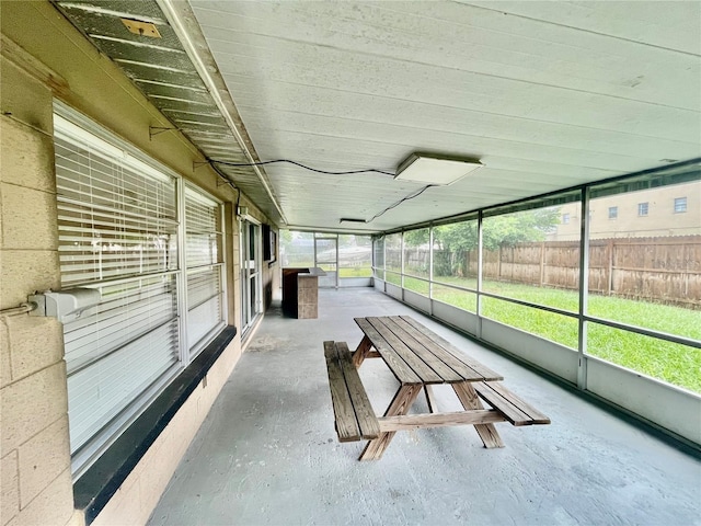 unfurnished sunroom with plenty of natural light