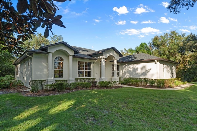 ranch-style house featuring a front lawn