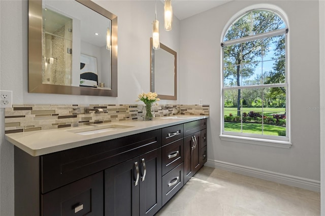 bathroom with decorative backsplash and vanity