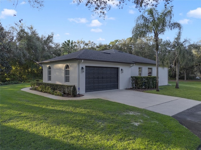 view of front of house featuring a garage and a front yard