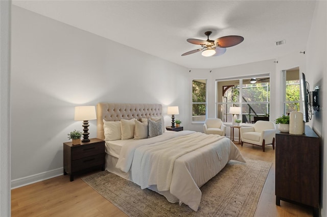 bedroom featuring ceiling fan and light hardwood / wood-style floors