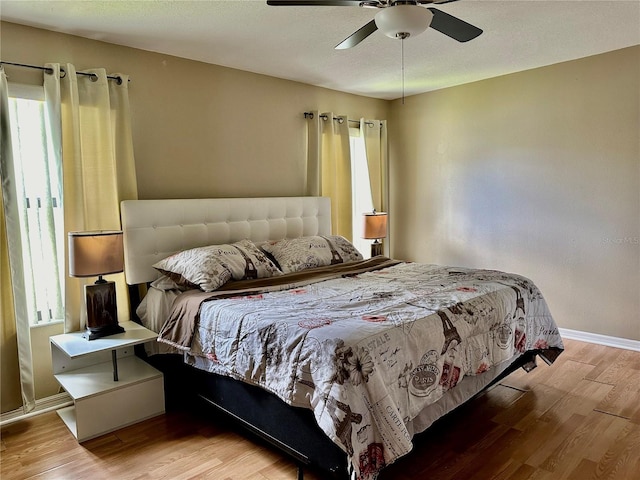 bedroom featuring light hardwood / wood-style flooring and ceiling fan