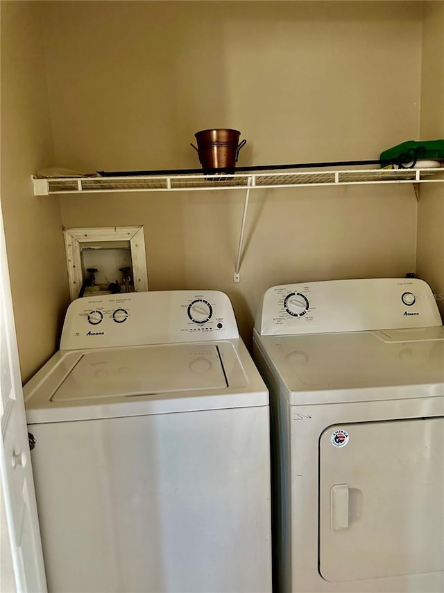 laundry area with washing machine and dryer