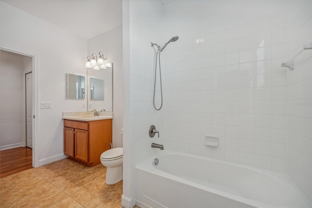 full bathroom with tile patterned flooring, vanity, toilet, and tiled shower / bath combo