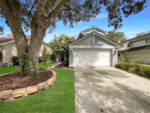 view of front of house featuring a garage and a front yard