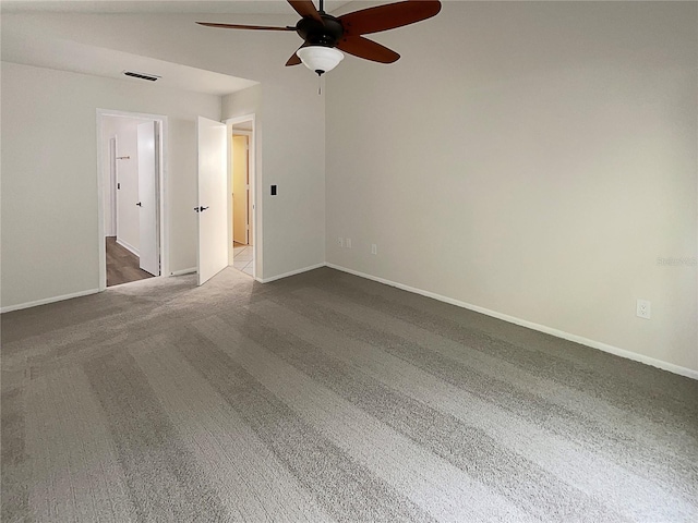 unfurnished room with ceiling fan and carpet flooring