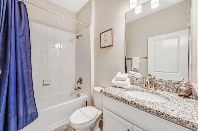 full bathroom featuring shower / bath combination with curtain, vanity, and toilet