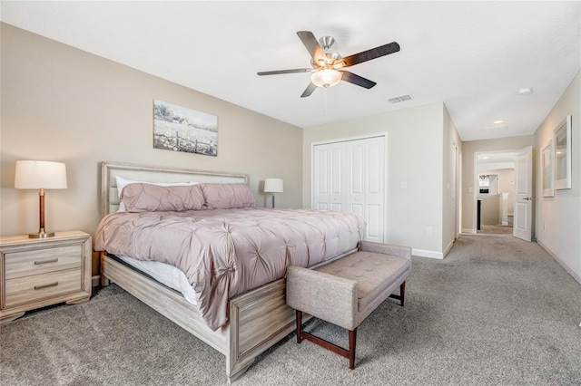 carpeted bedroom featuring ceiling fan and a closet