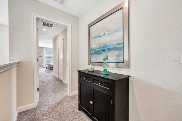 4782 Kings Castle Cir, Kissimmee, FL 34746 - hall featuring light colored carpet and baseboards
