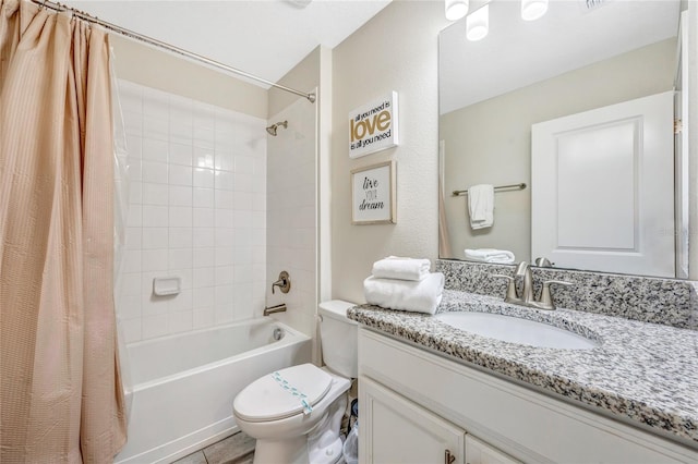 full bathroom featuring vanity, shower / tub combo, and toilet