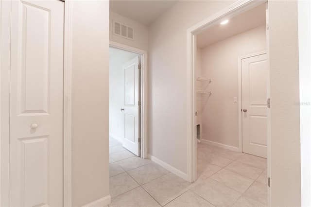 hallway with light tile patterned flooring