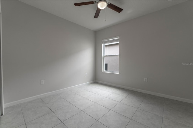 tiled empty room with ceiling fan